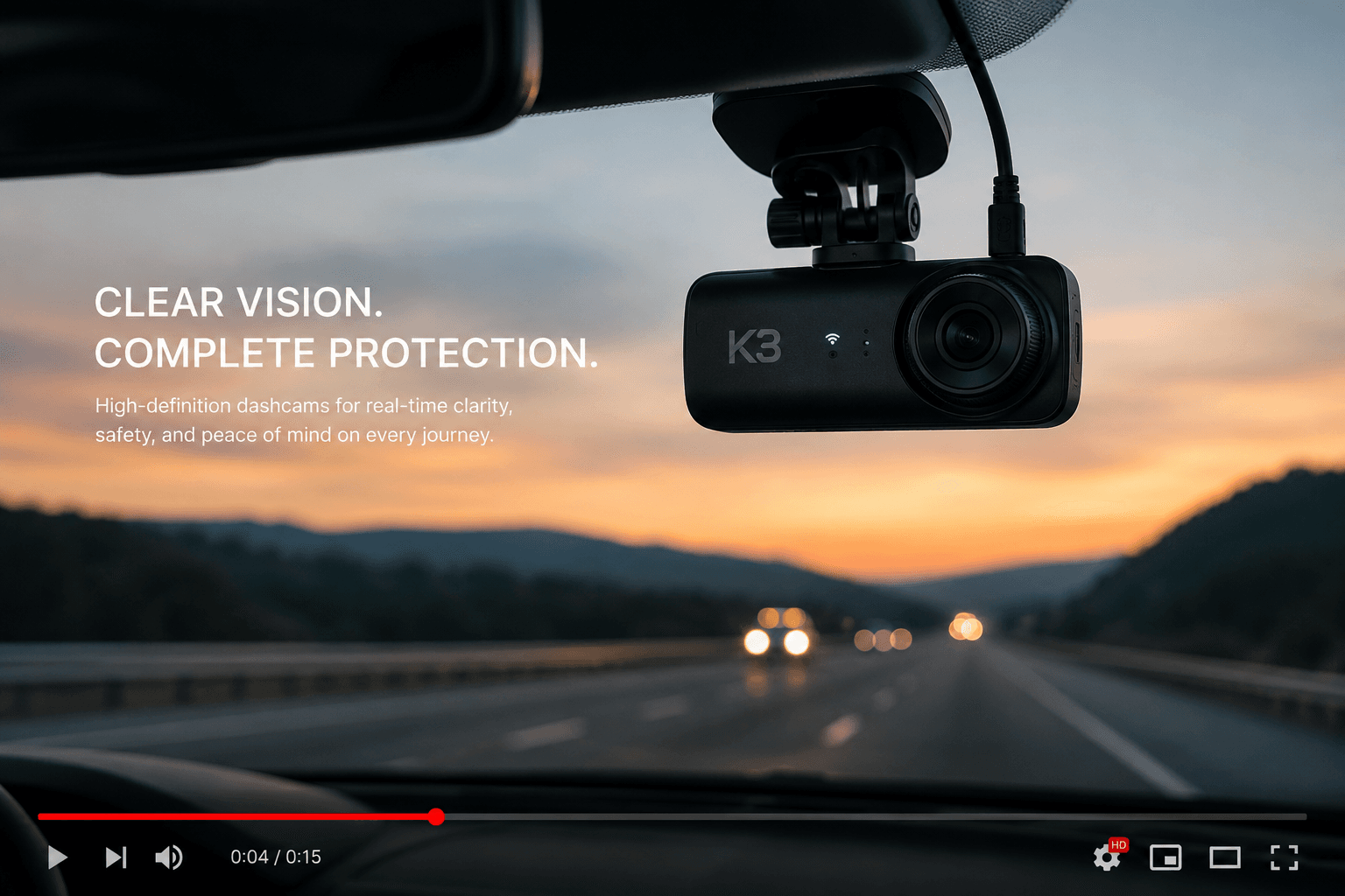 K3 dashcam mounted on a windshield capturing the road at sunset